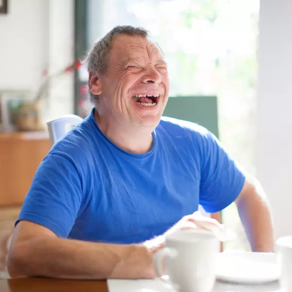 Happy disabled male smiling and laughing